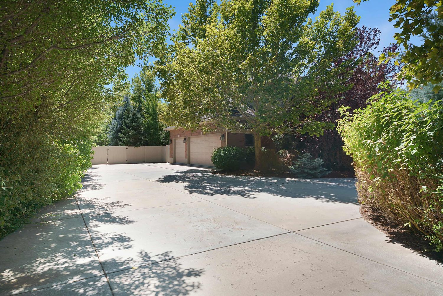 Finished concrete driveway beside a lawn
